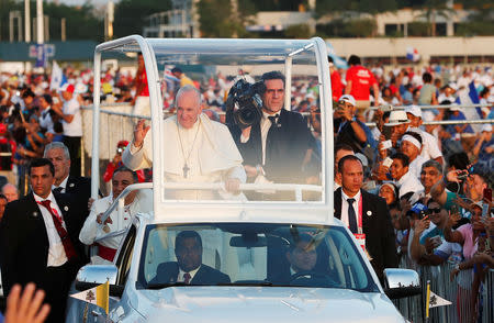 Pope Francis waves from his Popemobile as he arrives for a vigil at Saint Paul II Metro Park during World Youth Day in Panama City, Panama January 26, 2019. REUTERS/Carlos Jasso