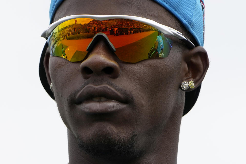 Miami Marlins outfielder Jazz Chisholm Jr. heads toward the dugout after warming up before the start of a spring training baseball game against the New York Mets Saturday, March 2, 2024, in Jupiter, Fla. (AP Photo/Jeff Roberson)