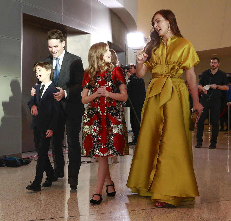 Former NASCAR driver Jeff Gordon, top left, and his family, from left: son Leo Benjamin, daughter Ella Sofia and wife Ingrid Vandebosch arrive on the red carpet before the NASCAR Hall of Fame induction ceremony for the Class of 2019, Friday, Feb. 1, 2019, in Charlotte, N.C. (AP Photo/Jason E. Miczek)