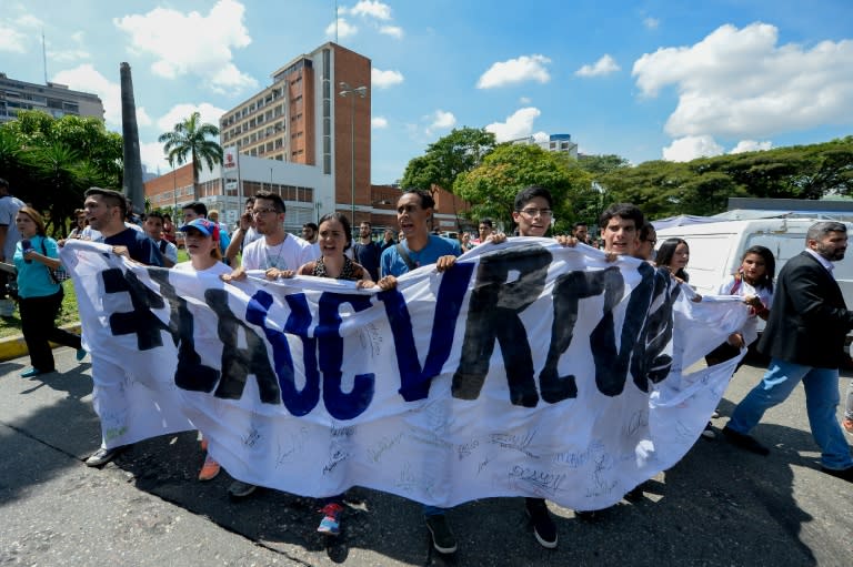 Students from the public Central University of Venezuela demonstrate in demand of the referendum on removing President Nicolas Maduro, in Caracas on October 21, 2016