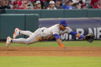 New York Mets third baseman Eduardo Escobar makes a catch on a ground ball hit by Los Angeles Angels' Anthony Rendon before throwing him out at first during the third inning of a baseball game Friday, June 10, 2022, in Anaheim, Calif. (AP Photo/Mark J. Terrill)