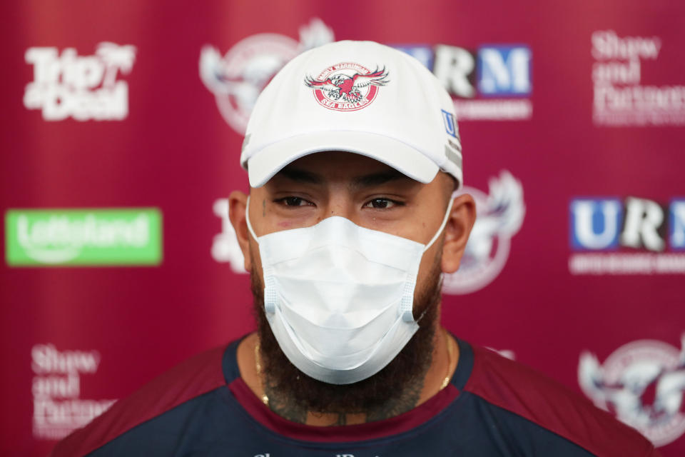 Addin Fonua-Blake is seen wearing a face mask as he talks to the media during a Manly Sea Eagles NRL training session. (Photo by Mark Metcalfe/Getty Images)