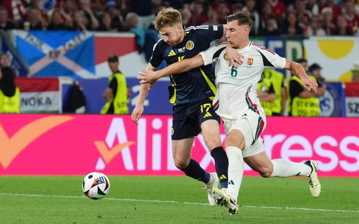 Scotland's Stuart Armstrong (left) and Hungary's Willi Orban battle for the ball during the UEFA Euro 2024 Group A match at the Stuttgart Arena