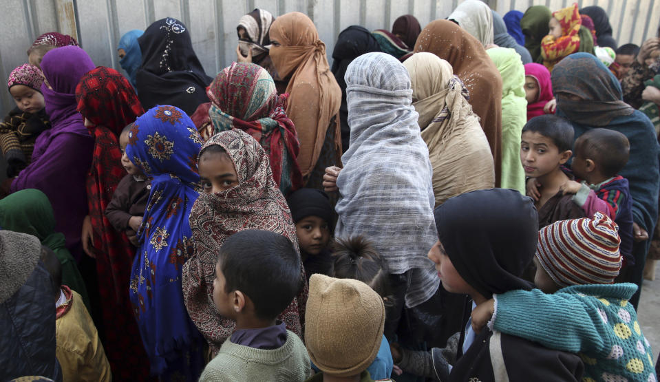 Family members of Islamic State militants either arrested or surrounded up to the Afghan government are presented to media in Kabul, Afghanistan, Saturday, Dec. 21, 2019. The country's intelligence service says Saturday that there are more than 75 women and 159 children most of them form foreign countries in the custody of the agency known as the National Deteriorate for Security. (AP Photo/Rahmat Gul)