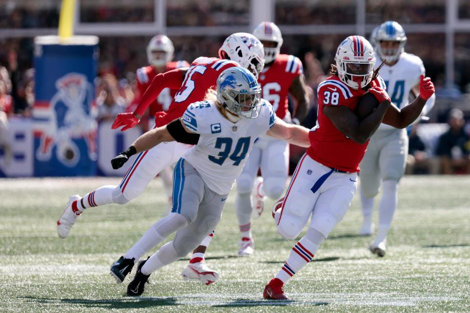 Lions linebacker Alex Anzalone tackles Patriots running back Rhamondre Stevenson during the first half on Sunday, Oct. 9, 2022, in Foxborough, Massachusetts.