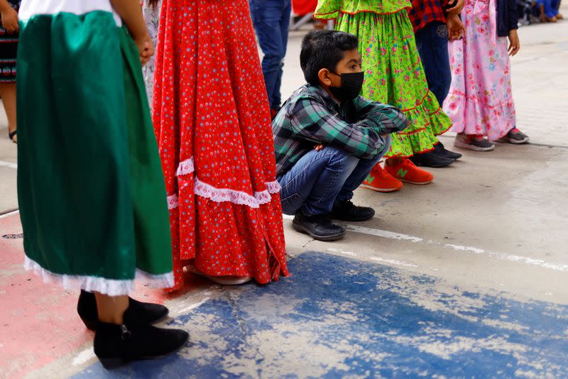 A student wearing a protective mask rests while attending an in-person class as the coronavirus disease (COVID-19) outbreak continues, in Ciudad Juarez