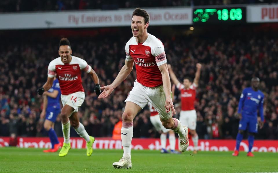 Laurent Koscielny of Arsenal celebrates after scoring his sides second goal during the Premier League match between Arsenal FC and Chelsea - Getty Images Europe