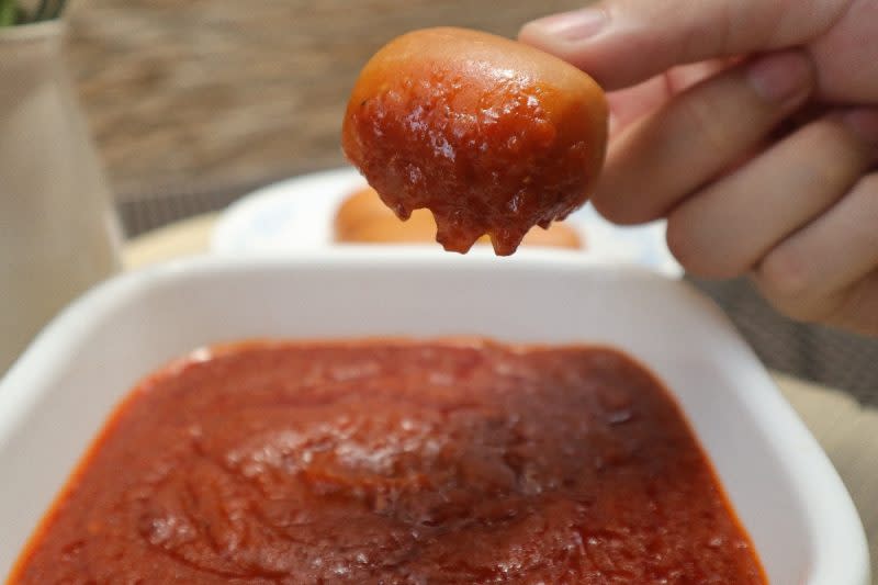 appetized - closeup of mantou dipping