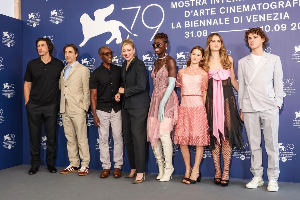 Adam Driver, from left, director Noah Baumbach, Don Cheadle, Greta Gerwig, Jodie Turner-Smith, May Nivola, Raffey Cassidy, and Sam Nivola pose for photographers at the photo call for the film 'White Noise' during the 79th edition of the Venice Film Festival in Venice, Italy, Wednesday, Aug. 31, 2022.