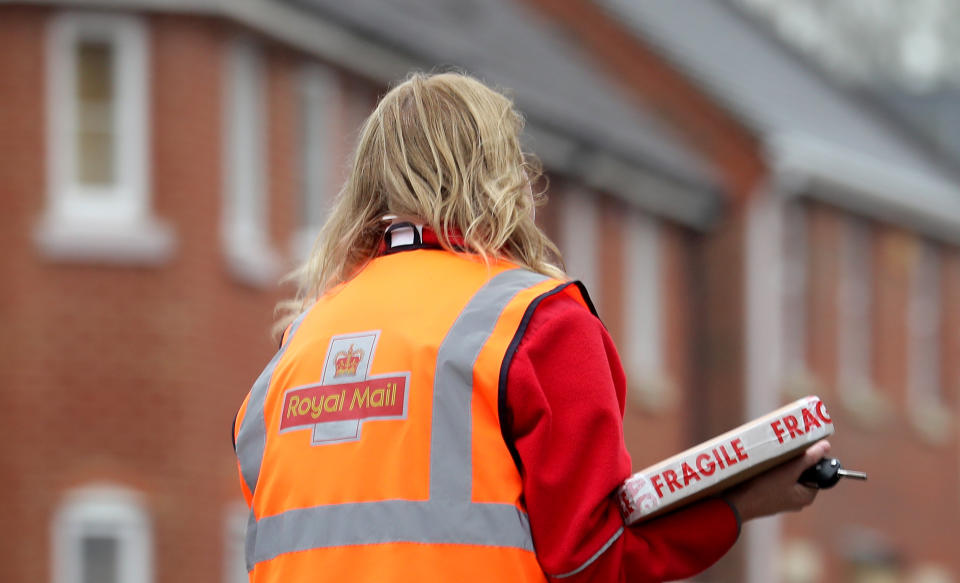 A Royal Mail delivery worker. Photo: Gareth Fuller/PA via Getty