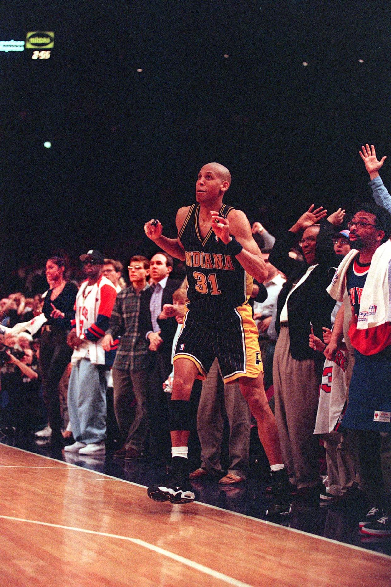 Reggie Miller of the Indiana Pacers hitting a clutch shot against the New York Knicks during their playoff battles in the 1990s.