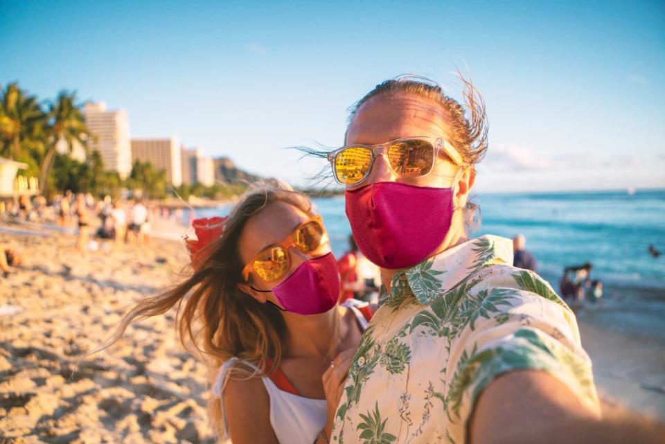 Couple takes selfie on Waikiki beach during Covid-19 pandemic