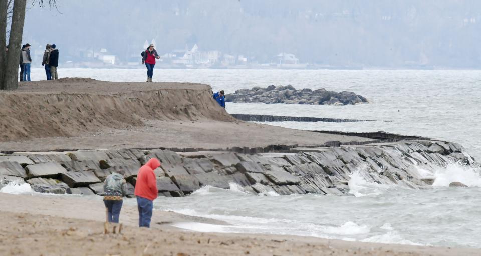 Personnel from the U.S. Army Corps of Engineers and the Pennsylvania Department of Conservation & Natural Resources, top, conduct the spring 2024 beach walk at Presque Isle State Park.