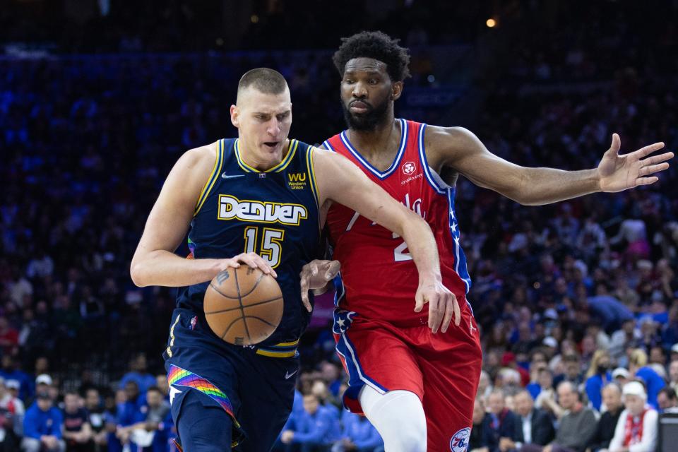 Nuggets center Nikola Jokic (15) and 76ers center Joel Embiid (21) are two of the lead candidates for the MVP award.