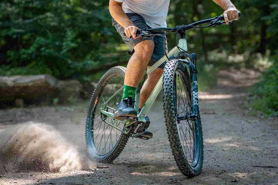 man riding a mountain bike with Gates belt drive