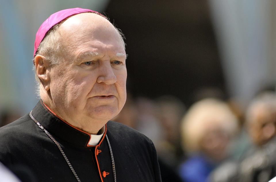 Bishop Emeritus Daniel P. Reilly walks the Stations of the Cross procession through downtown Worcester in a 2011 file photo.