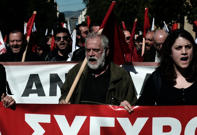 Demonstrators shout slogans during a 24-hour general strike in Athens on February 20, 2013. Successive cuts to salaries and pensions over the past three years have angered Greeks who have frequently taken to the streets to demonstrate their frustration