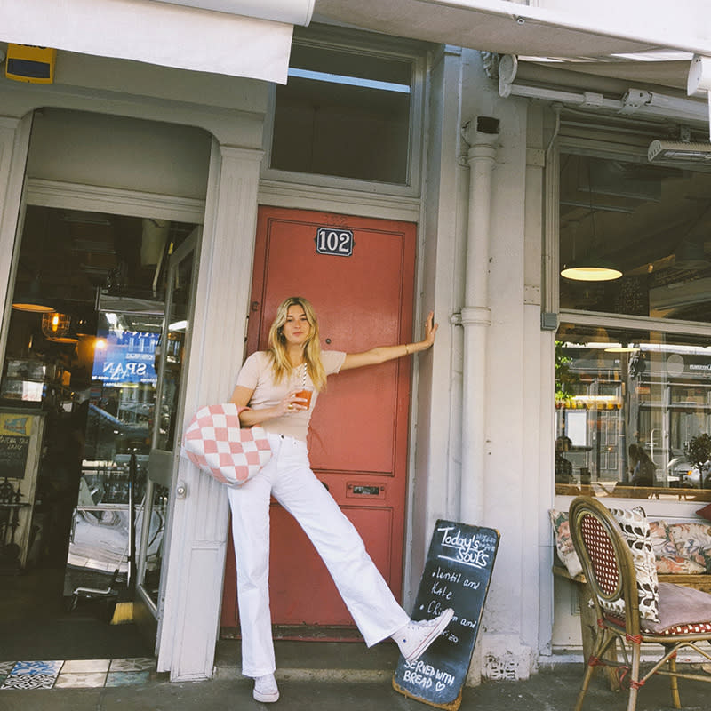 <p><span>Keep to a light, neutral palette with a sand-colored tee tucked into white jeans. Accessorize with a statement bag and, of course, your high tops.</span></p> <h4>@camillecharriere</h4>