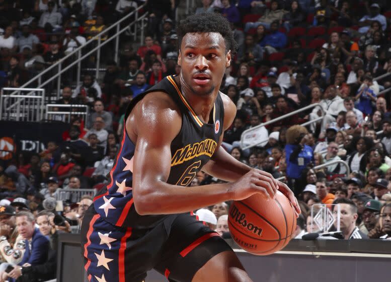 McDonalds High School All American West guard Bronny James (6) drives to the basket