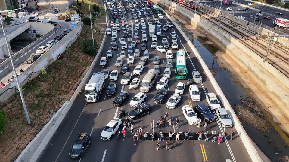 Relatives and supporters of Israeli hostages block Ayalon Highway in Tel Aviv on Thursday. - Jack Guez/AFP/Getty Images