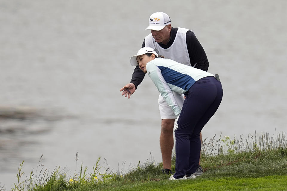 Xiyu Janet Lin, of China, measures her shot on the sixth hole during the second round of the U.S. Women's Open golf tournament at the Pebble Beach Golf Links, Friday, July 7, 2023, in Pebble Beach, Calif. (AP Photo/Darron Cummings)