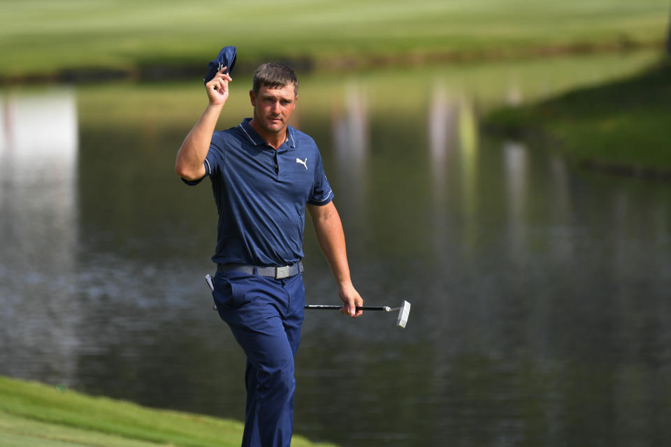 Bryson Dechambeau walks up to the 18th green during the third round in the World Golf Championship-FedEx St. Jude Invitational tournament, Saturday, Aug. 7, 2021, in Memphis, Tenn. (AP Photo/John Amis)