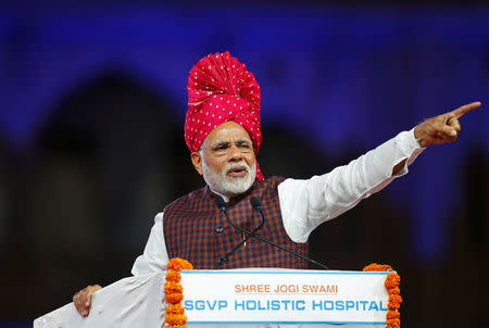 Prime Minister Narendra Modi gestures as he addresses his supporters during an election campaign meeting ahead of Gujarat state assembly elections, in Ahmedabad, December 3, 2017. REUTERS/Amit Dave