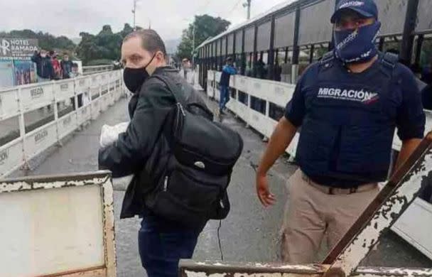 PHOTO: Jerrel Kenemore stands at a Colombian checkpoint in the middle of the Simon Bolivar international bridge connecting San Antonio del Tachira, Venezuela with Villa del Rosario, Colombia, the second week of March 2022. (Kenemore family via AP)