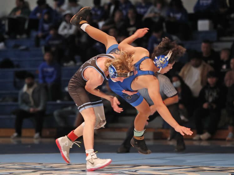 CdM's Vallon Johannesson throws F.V.'s Chris Qureshi during a Surf League wrestling meet.