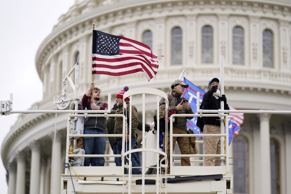 FILE - Supporters of President Donald Trump riot at the Capitol in Washington, on Jan. 6, 2021. Trump is making the Jan. 6, 2021 attack on the Capitol a cornerstone of his bid to return to the White House. Trump opened his first rally as the presumed Republican Party presidential nominee standing in salute with a recorded chorus of Jan. 6 prisoners singing the national anthem. (AP Photo/Julio Cortez, File)