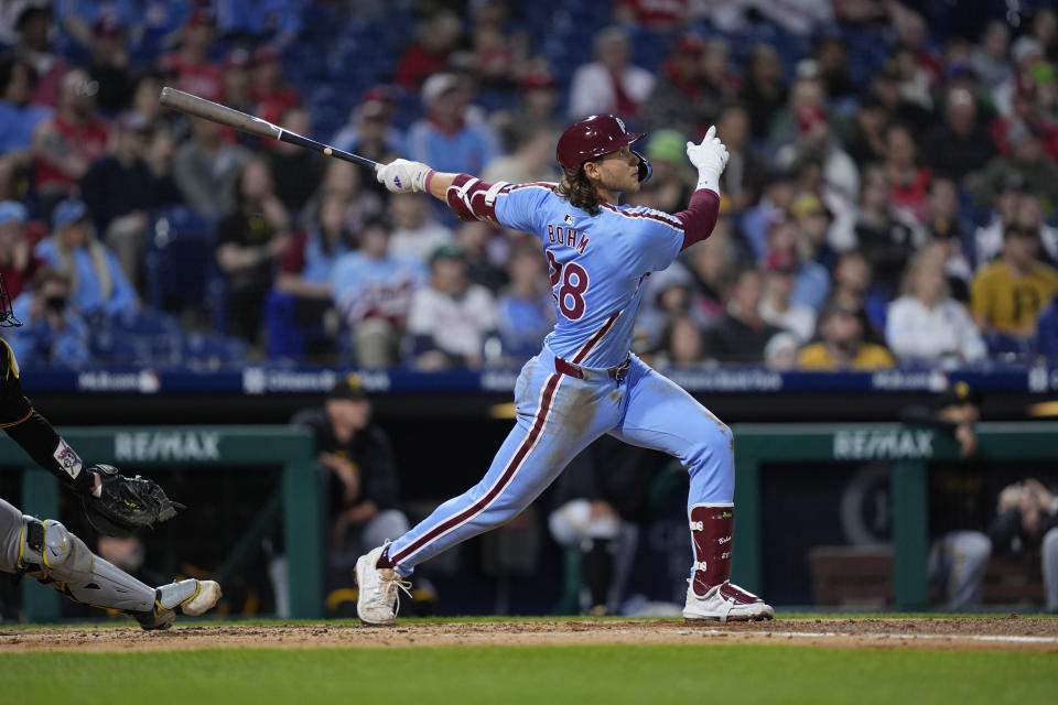 Philadelphia Phillies' Alec Bohm follows through after hitting a home run off of Pittsburgh Pirates' Jared Jones during the fourth inning of a baseball game, Thursday, April 11, 2024, in Philadelphia. (AP Photo/Matt Rourke)