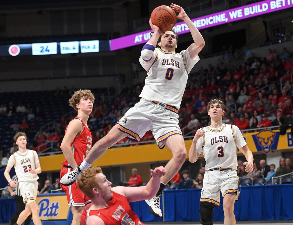 OLSH's Jake DiMichele shoots over Fort Cherry defenders during the WPIAL Class 2A championship game on Saturday, March 5, at the Petersen Events Center in Pittsburgh.
