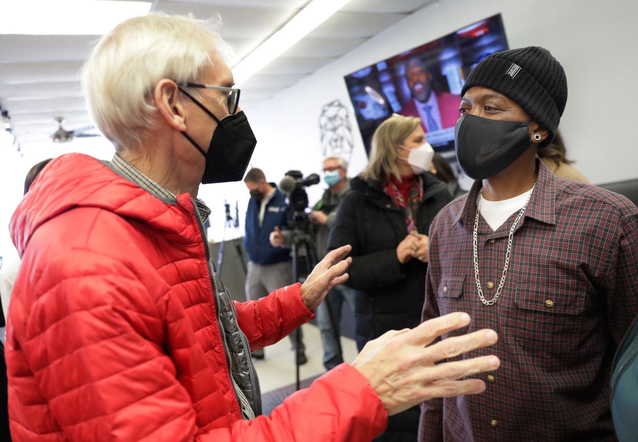 Gov. Tony Evers meets with Cainan Davenport, also known as K the Barber, co-owner of Taperz Barbershop on Tuesday, January 11, 2022, in Appleton, Wis. Taperz was among thousands of Wisconsin small businesses that received a We’re All In grant from the state to help small businesses through to COVID-19 pandemic.