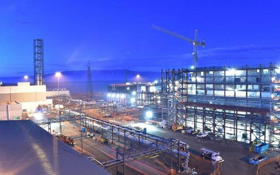 Fog rolls over the vitrification plant at the Hanford nuclear reservation. In part of the plant that has been completed, a second radioactive waste melter has been heated to 300 degrees.