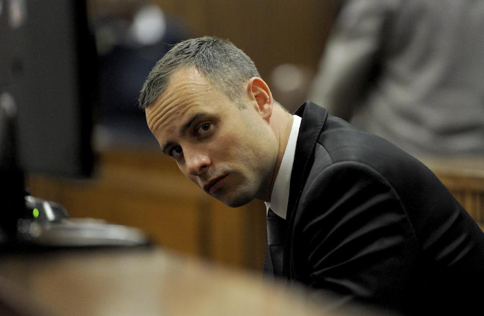 Oscar Pistorius sits in court for his ongoing murder trial in Pretoria, South Africa, Monday, May 12, 2014. Pistorius is charged with the shooting death of his girlfriend Reeva Steenkamp on Valentine's Day in 2013. (AP Photo/Chris Collingridge, Pool)