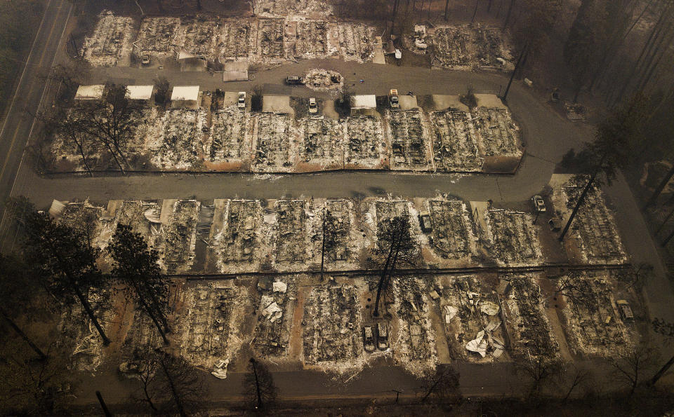FILE - Residences leveled by a wildfire in Paradise, Calif., are seen on Nov. 15, 2018. Officials in Paradise began testing a new wildfire siren system this summer as the five-year anniversary of the deadly and devastating wildfire approaches. Reliable warning systems are becoming more critical during wildfires, especially as power lines and cell towers fail, knocking out communications critical to keeping people informed. (AP Photo/Noah Berger, File)