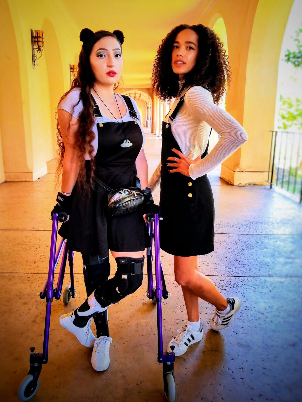 Drewy NovaClara Curious with her crutches and her friend posing together.