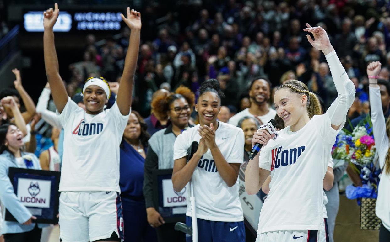 Paige Bueckers tells the UConn crowd she will be returning for the 2024-25 season.