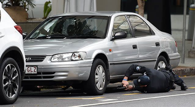 Police officers check a suspicious vehicle. Source: AAP Image/Dan Peled