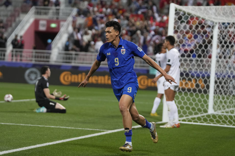 Thailand's Supachai Chaided celebrates after scoring the opening goal during the Asian Cup Group F soccer match between Kyrgyzstan and Thailand at Abdullah Bin Khalifa Stadium in Doha, Qatar, Tuesday, Jan. 16, 2024. (AP Photo/Thanassis Stavrakis)