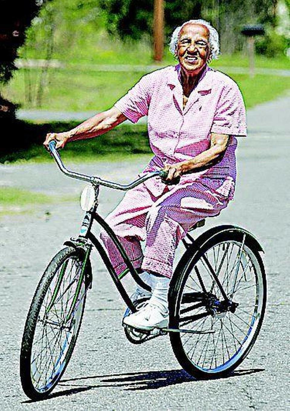 Janie Mae Agurs rides her new bike in her neighborhood Thursday.