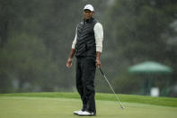 Tiger Woods reacts after missing a putt on the 18th hole during the weather delayed second round of the Masters golf tournament at Augusta National Golf Club on Saturday, April 8, 2023, in Augusta, Ga. (AP Photo/Charlie Riedel)