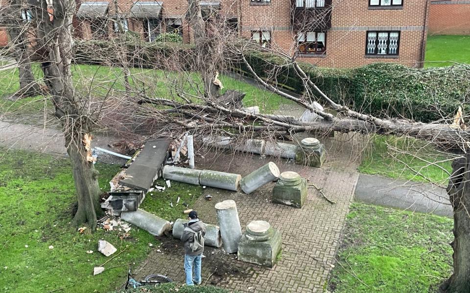 A tree blown over by the wind and crashed into the portico, knocking it down in Tooting