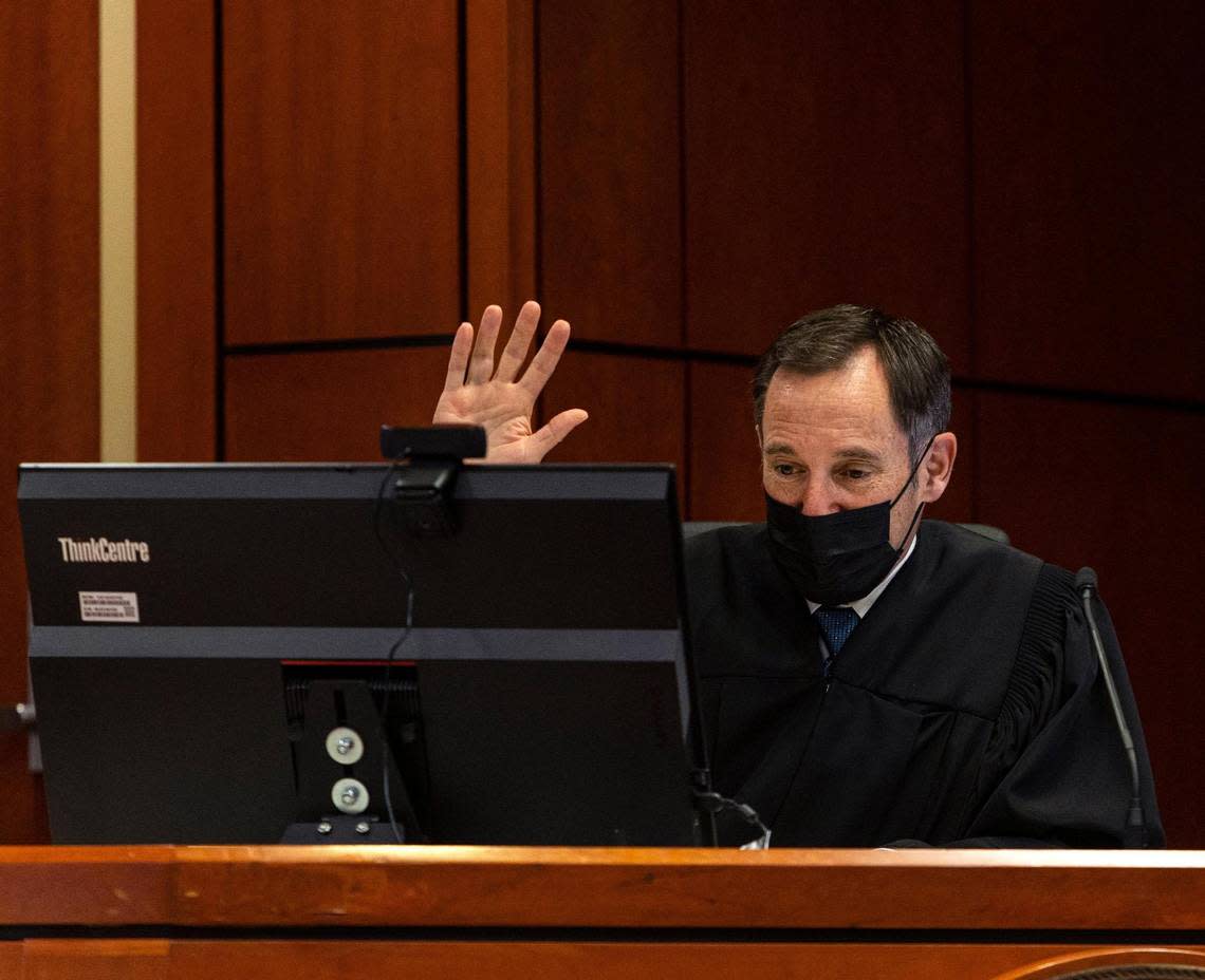 Fourth District Judge Patrick Miller swears in a witness over a computer screen during the sentencing of Danielle Radue on Friday.