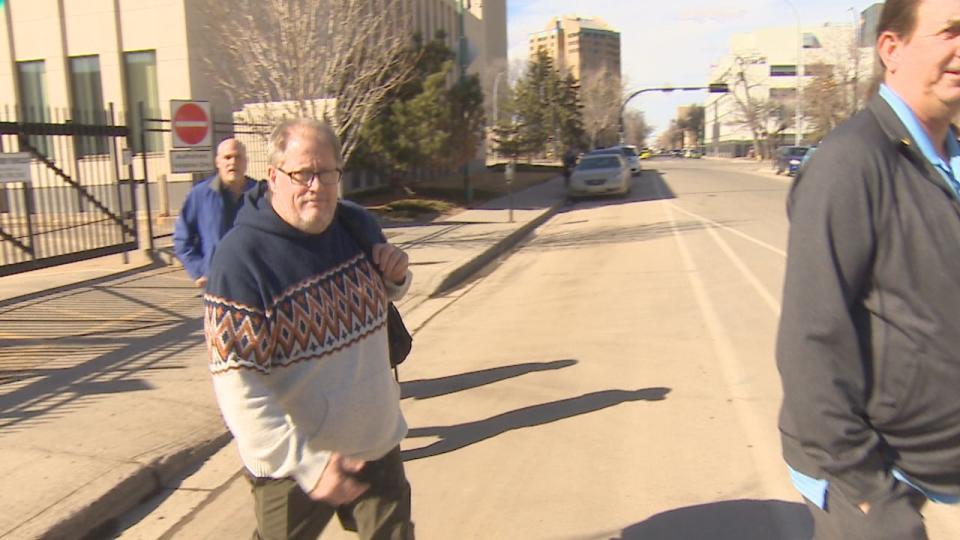 Michael Gordon Jackson leaves Regina Court of King's Bench Tuesday with some friends and supporters. (Richard Agecoutay/CBC - image credit)