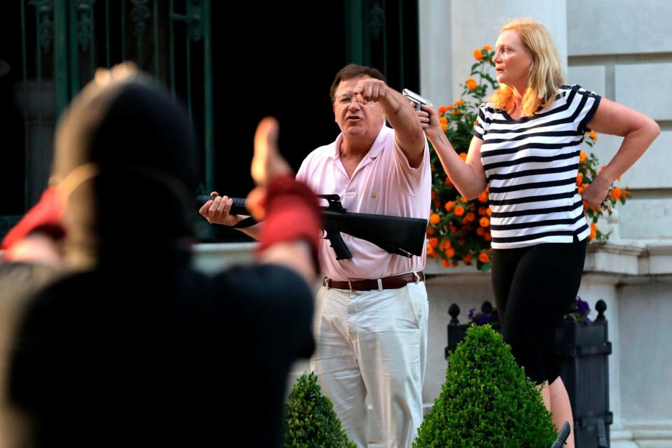 The armed homeowners pointed guns at protesters marching to Mayor Lyda Krewson's house (AP)