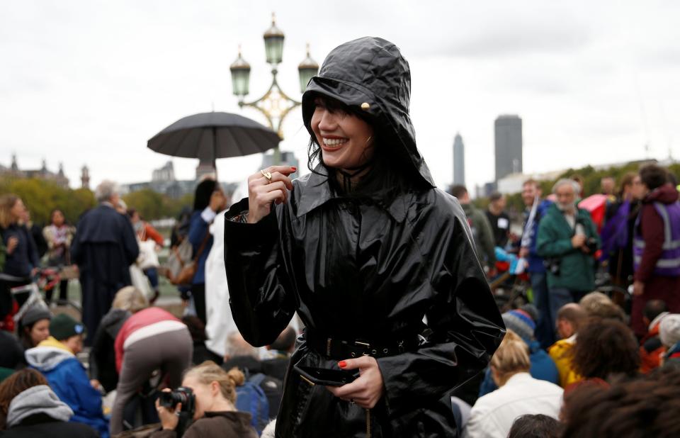 Model behaviour: Daisy Lowe is pictured at the XR protests (REUTERS)