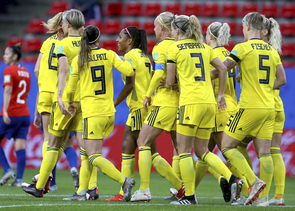 Sweden's Madelen Janogy, 4th left with red hairband, celebrates after scoring her side's 2nd goal during the Women's World Cup Group F soccer match between Chile and Sweden at the Roazhon Park in Rennes, France, Tuesday, June 11, 2019. (AP Photo/David Vincent)