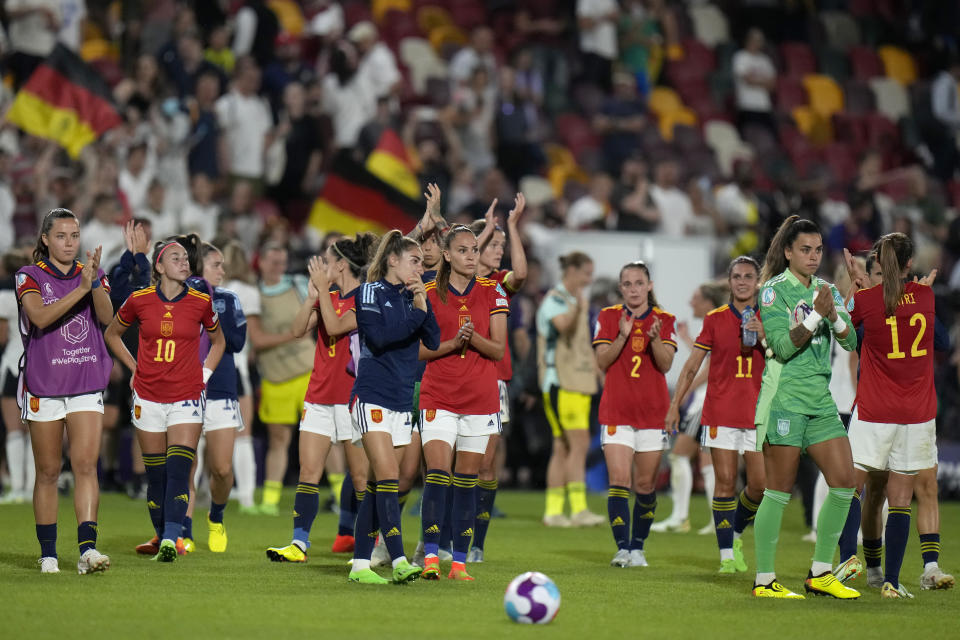 FILE - Spain players applaud the fans at the end of a Women Euro 2022 group B soccer match against German on July 12, 2022, in London. Germany won 2-0. Fifteen players are expected to quit Spain's national team after their demand for a coaching change was rejected by the Spanish federation on Thursday, Sept. 22. The federation said it received identical emails from the 15 players saying they would renounce their places on the team if coach Jorge Vilda wasn’t fired. (AP Photo/Alessandra Tarantino, File)