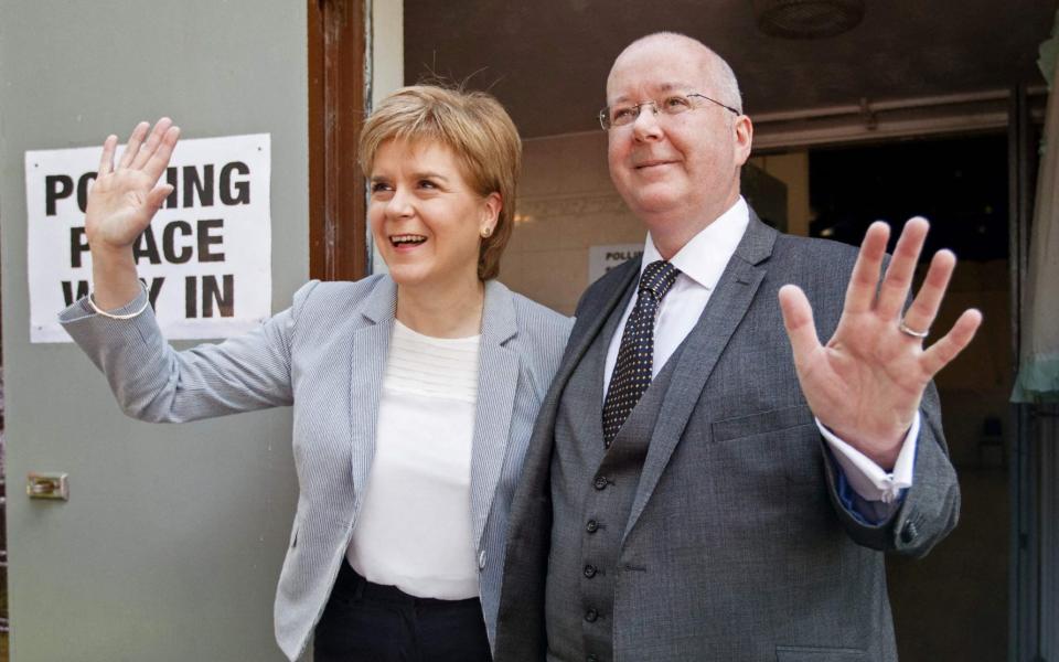 Nicola Sturgeon and her husband Peter Murrell - AFP